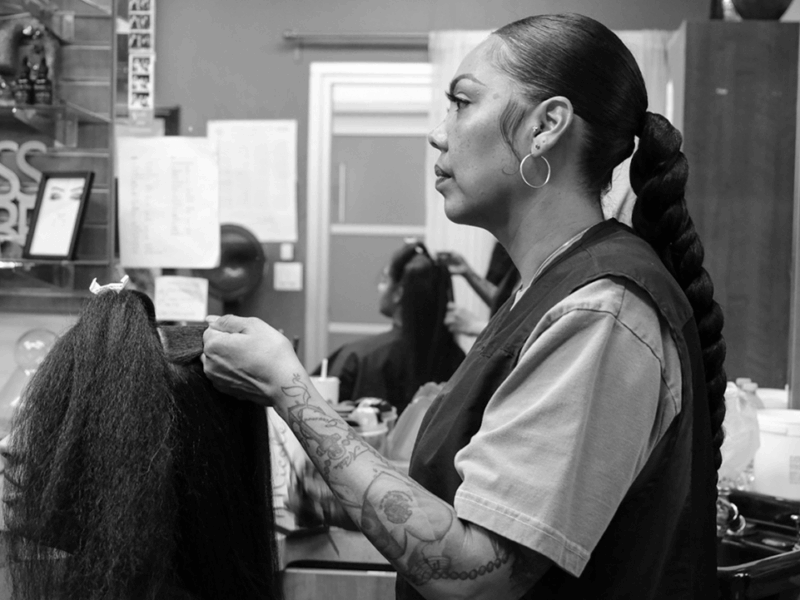 Niekol Garcia styles a client’s hair on February 8, 2025, at Red Carpet Ready Studio in Rancho Cucamonga, California. One of Garcia’s favorite parts of the job is connecting with her clients. This is the type of small business the newly launched San Bernardino County online platform BizHUUB is designed to support.